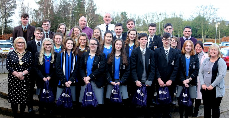 The Mayor of Causeway Coast and Glens Borough Council, Councillor Brenda Chivers pictured with PCSP Chair, Margaret-Anne Mc Killop, PCSP Vice Chair, Anthony Mc Peake, PSNI Chief Inspector Ian Magee with pupils and teachers from Ballycastle High School, Dominican College and Cross and Passion College at a special policing and community safety event in Cloonavin.