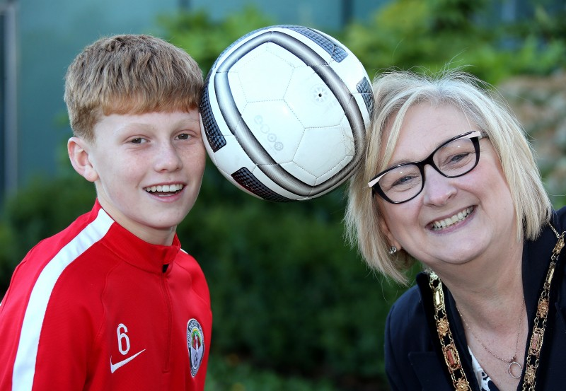 The Mayor of Causeway Coast and Glens Borough Council Councillor Brenda Chivers pictured with Bertie Peacock Youth Under 13 team captain Taylor McBride at a civic reception in Cloonavin.