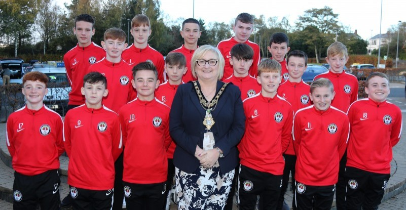 The Mayor of Causeway Coast and Glens Borough Council Councillor Brenda Chivers pictured with members of the Bertie Peacock Youth Under 13 team, winners of the NIBFA Cup and finalists in the Super Cup NI Minor Section.