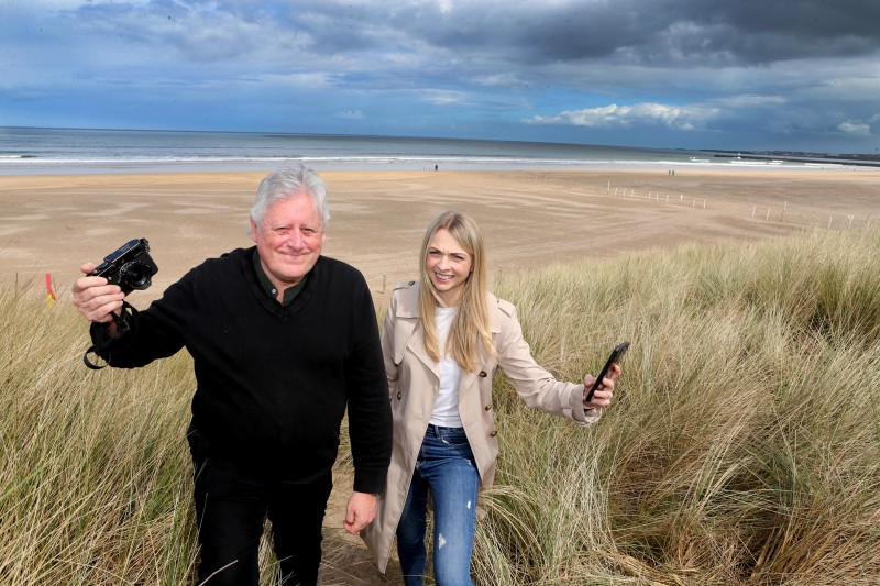 Amy Donaghey, Causeway Coast and Glens Council’s Arts Marketing and Engagement Officer getting some tips from photographer James Hughes at Castlerock Beach.