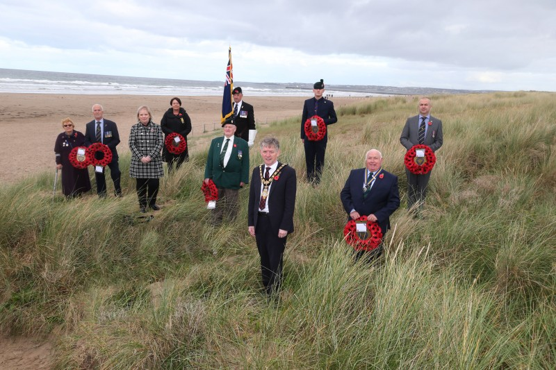 The Mayor, Alderman Mark Fielding, and Council Veterans' Champion, Councillor Michelle Knight-McQuillan meet with representatives from the Dunboe branch of the Royal British Legion at Castlerock Beach