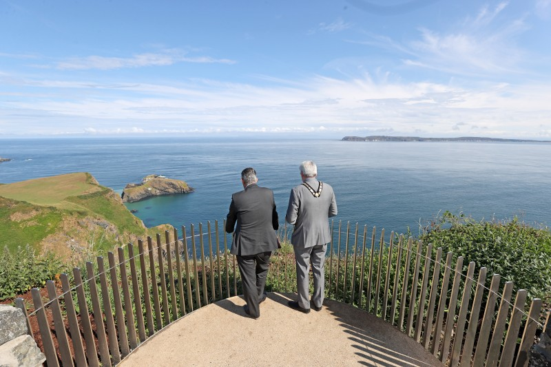 The Mayor of Causeway Coast and Glens Borough Council Councillor Richard Holmes and Minister for Agriculture, Environment and Rural Affairs Edwin Poots enjoy the spectacular views from one of the new viewing platforms at Portaneevy outside Ballintoy.
