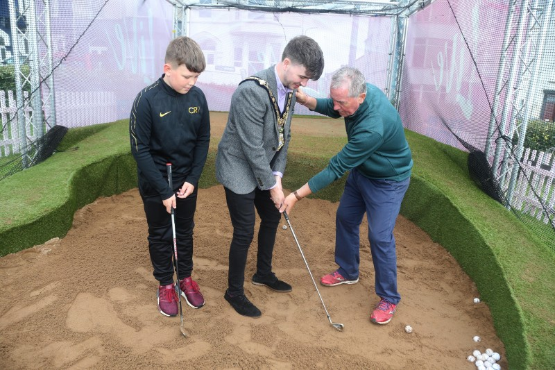 The Mayor of Causeway Coast and Glens Borough Council Councillor Sean Bateson pictured practising his swing at the golf simulator experience at Antrim Gardens.