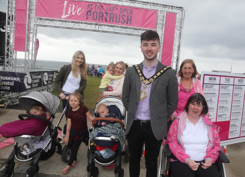 The Mayor of Causeway Coast and Glens Borough Council Councillor Sean Bateson pictured with happy visitors at ‘Live at the 148th Open’ at Kerr Street Green in Portrush.