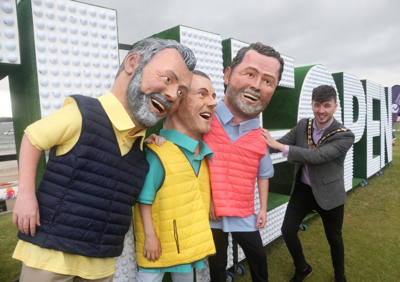 The Mayor of Causeway Coast and Glens Borough Council Councillor Sean Bateson pictured with the ‘big head’ caricatures of Graeme McDowell, Rory McIlroy and Darren Clarke at Kerr Street Green.