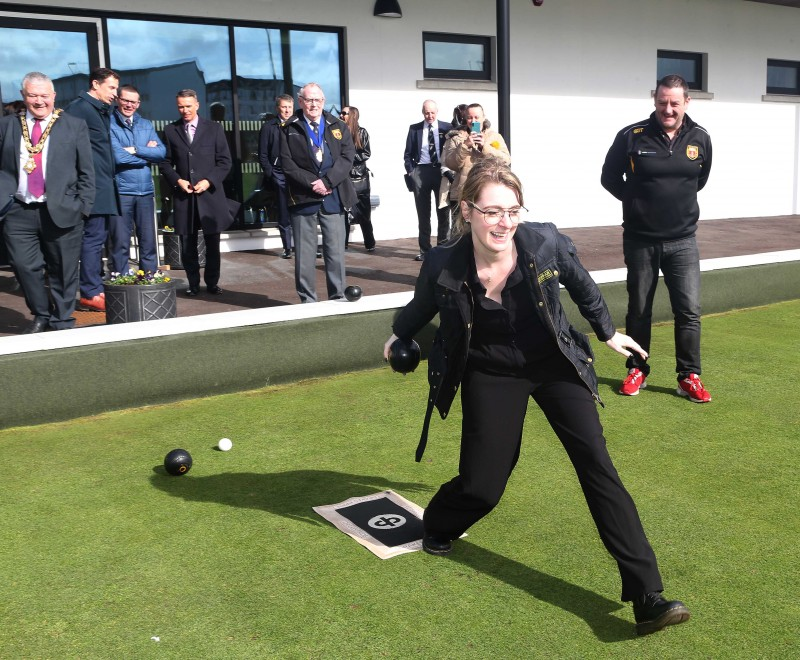 Dehenna Davison, Parliamentary Under-Secretary of State for the Department for Levelling Up, Housing and Communities, tries some bowling with pupils from Portrush Primary School.