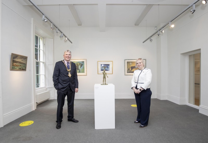 Mayor of Causeway Coast and Glens Borough Council Councillor Richard Holmes and Chairperson of Council’s NI 100 Working Group, Councillor Michelle Knight-McQuillan pictured viewing the pieces from Council’s arts and museums’ collections at the Causeway Collection 100 exhibition at Flowerfield Arts Centre