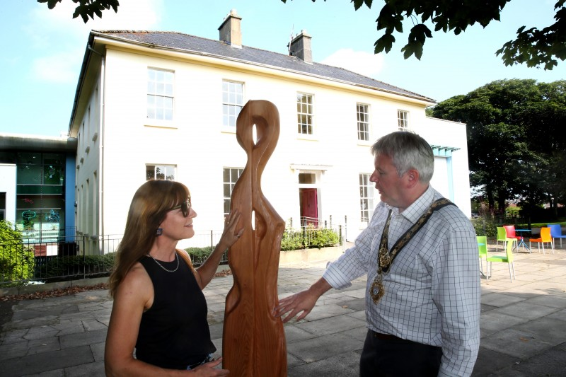 The Mayor of Causeway Coast and Glens Borough Council Councillor Richard Holmes views the ‘More is Different’ series of sculptures with artist Sara Cunningham Bell at Flowerfield Park in Portstewart.