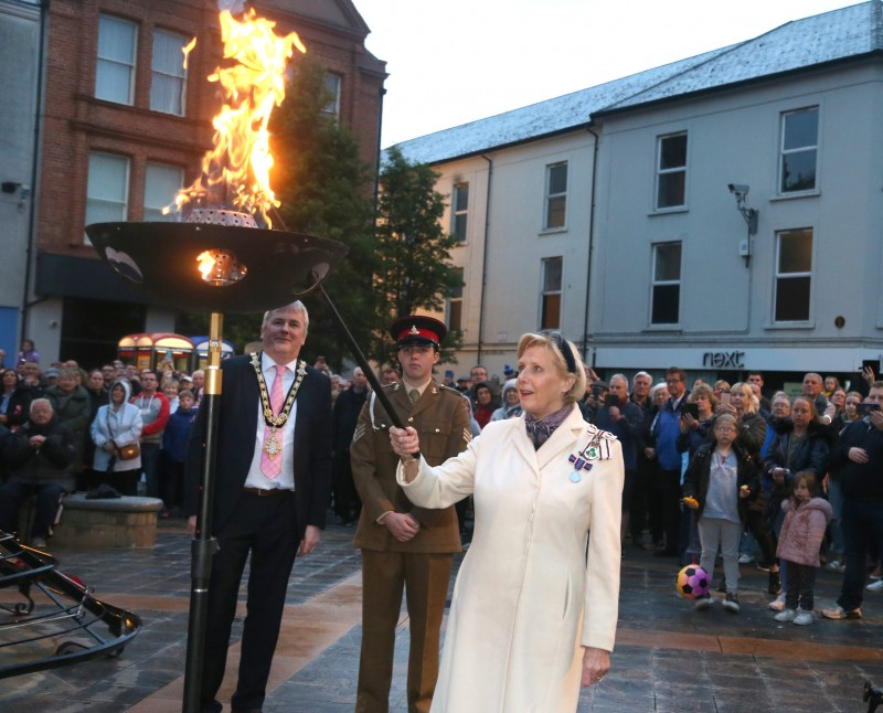 The Lord Lieutenant of County Londonderry Mrs Alison Millar steps forward the light the Platinum Jubilee beacon in Coleraine, watched on by members of the public who gathered to watch the event.