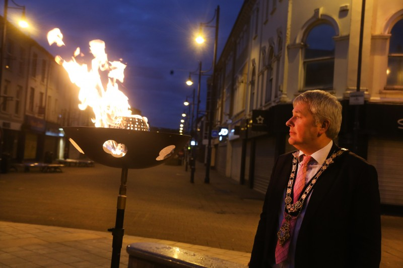 The Mayor of Causeway Coast and Glens Borough Council Councillor Richard Holmes takes a moment to reflect beside the Platinum Jubilee beacon in Coleraine.