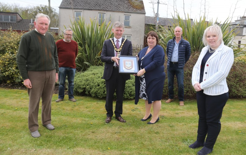 The Mayor of Causeway Coast and Glens Borough Council Alderman Mark Fielding and Mayoress Mrs Phyliss Fielding present a framed Coat of Arms to representatives of Garvagh Clydesdale and Vintage Vehicle Club including treasurer Andrew Wilson, Chairman Nevin Smith, Vice Chairman Gerald Stewart and Secretary Michelle Knight-McQuillan.