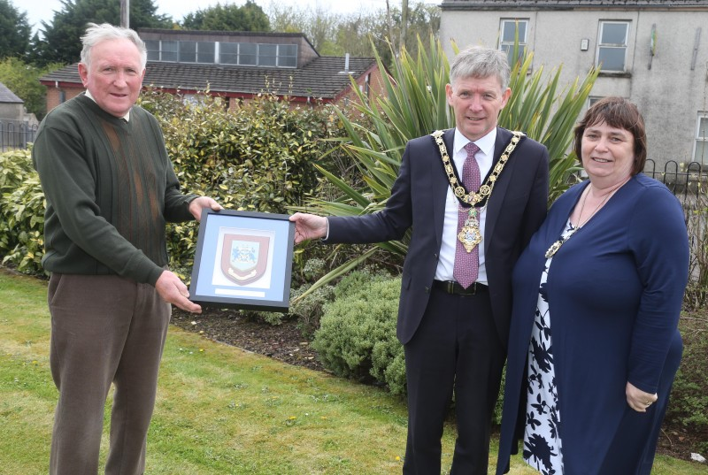 Nevin Smith, Chairman of Garvagh Clydesdale and Vintage Vehicle Club, receives a framed Coat of Arms from Mayor of Causeway Coast and Glens Borough Council Alderman Mark Fielding and the Mayoress Mrs Phyliss Fielding in recognition of the club’s Queen’s Award for Voluntary Service.