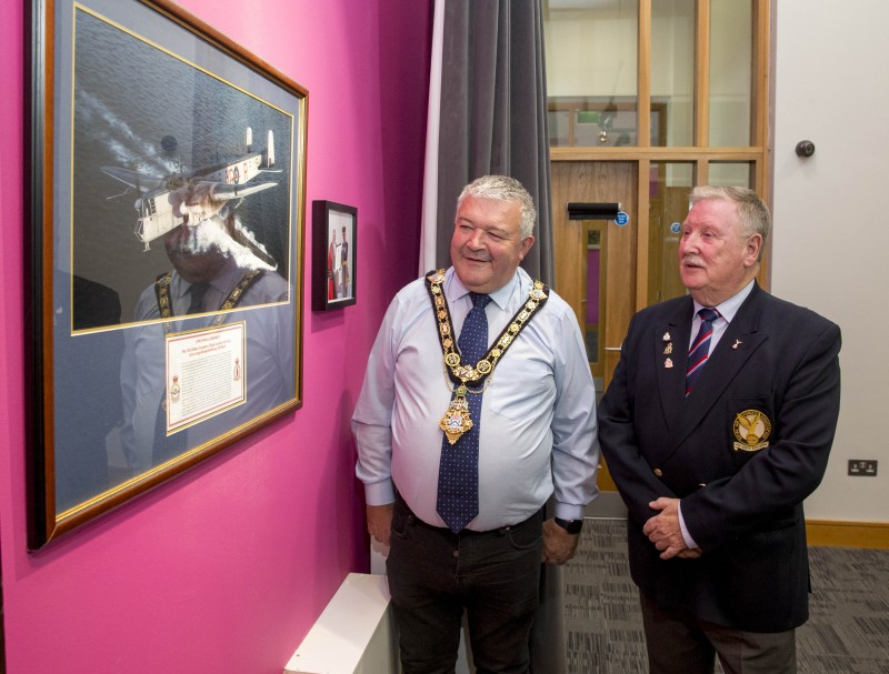 The Mayor of Causeway Coast and Glens Borough Council, Councillor Ivor Wallace, and William Mulligan, Chairman of the Roe Valley branch of the Royal Air Force Association, look at the framed image of the Armstrong Whitworth Whitley GR Mk.VII presented by the RAF after it received the Freedom of the Borough place earlier this year.