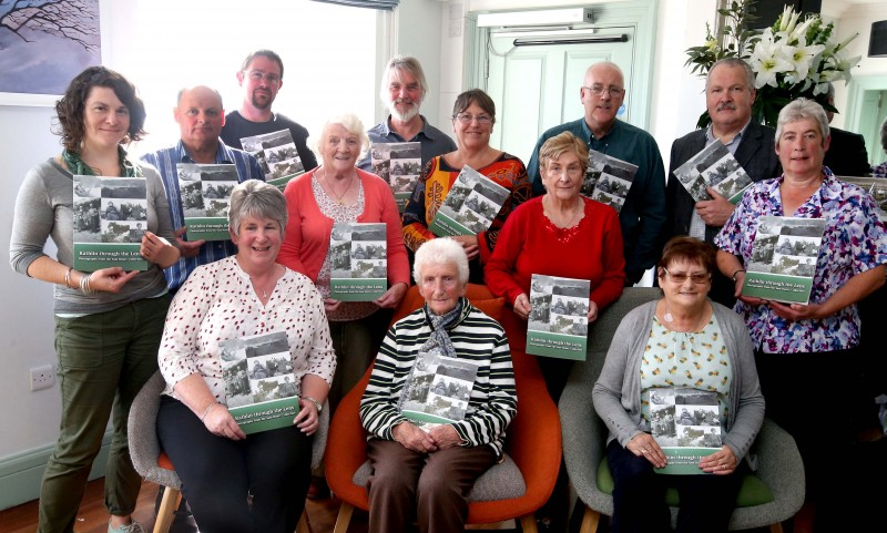 Members of the Rathlin Island community pictured with Sam Henry's grandson Gordon Craig and Nic Wright from Causeway Coast and Glens Borough Council's Museum Services.
