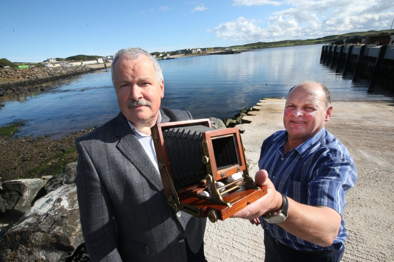 Sam Henry's camera is proudly displayed by his grandson Gordon Craig and Noel McCurdy on Rathlin Island.