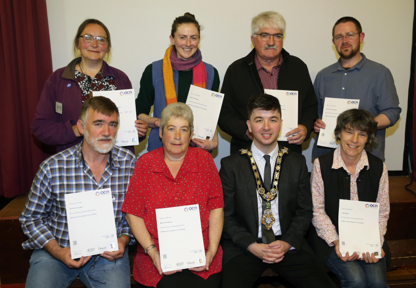 The Mayor of Causeway Coast and Glens Borough Council Councillor Sean Bateson pictured with Rathlin Island’s newly accredited tour guides. Back row from left to right: Teresa Frecker, Hazel Watson, Brian Gormley, Dr Nic Wright; front row from left to right: David Quinney Mee, Marina McMullan, and Julie Staines.