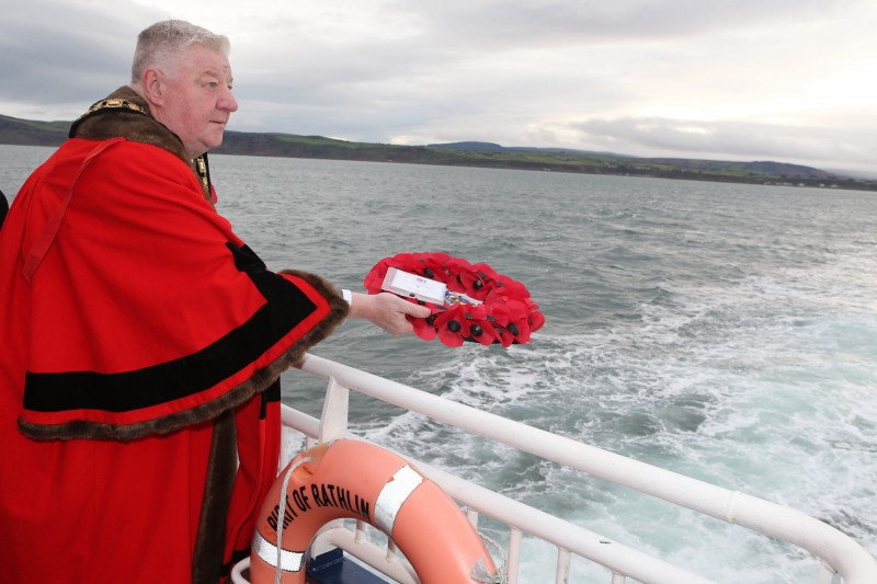 Mayor of Causeway Coast and Glens, Councillor Steven Callaghan lays a wreath at sea on his way to Rathlin Island Remembrance Service
