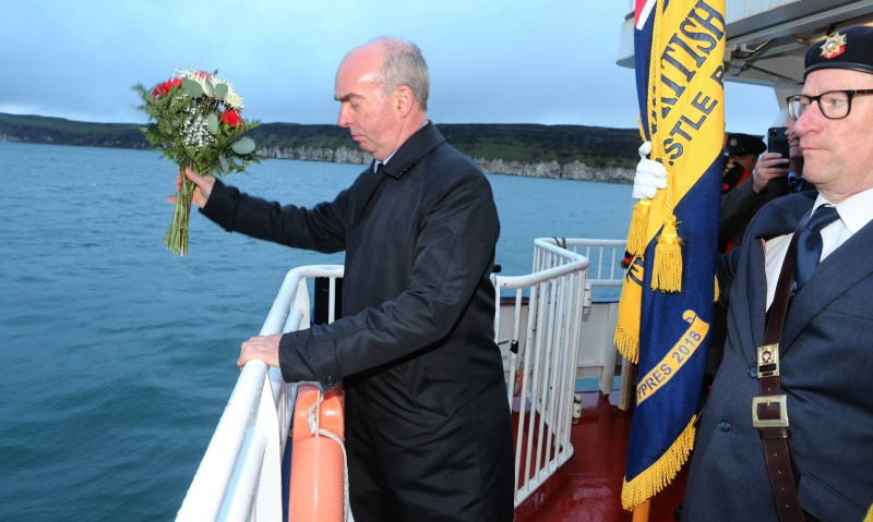Commander Rob Milligan, Royal Navy, lays a wreath at sea at HMS Drake site at Church Bay, Rathlin Island.