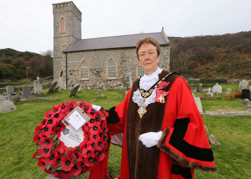 The Mayor of Causeway Coast and Glens Borough Council, Councillor Joan Baird OBE, pictured with the wreath in remembrance of those people who lost their lives on HMS Racoon and HMS Viknor.