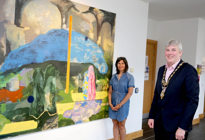 Mayor, Richard Holmes, and Sharon Calhoun from Roe Valley Arts and Cultural Centre in Limavady view the artwork at the exhibition Under the Same Sun’ which will run from Saturday 17th July to Saturday 21st August.