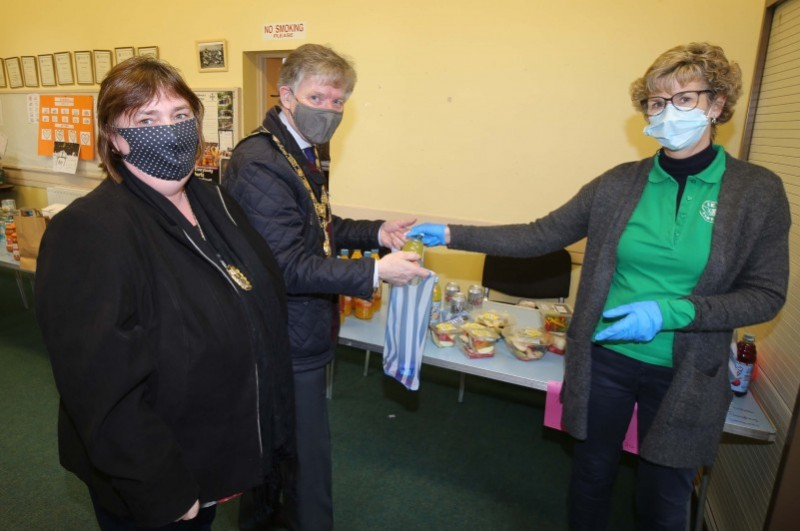The Mayor of Causeway Coast and Glens Borough Council, Alderman Mark Fielding and his wife Phyllis at the Reach community foodbank facility in Portrush with Reach volunteer Alex McNaull.