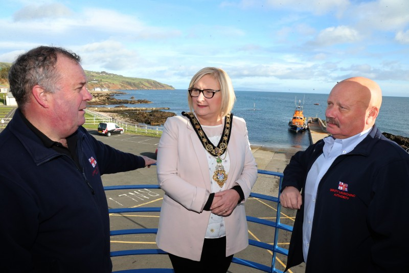 The Mayor of Causeway Coast and Glens Borough Council Councillor Brenda Chivers chats with Deputy Launching Authority Joe Burns and Andrew McAlister Lifeboat Operations Manager.