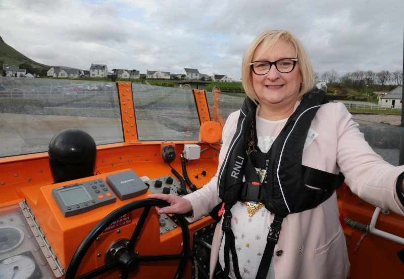 The Mayor of Causeway Coast and Glens Borough Council Councillor Brenda Chivers pictured at the helm of the lifeboat.