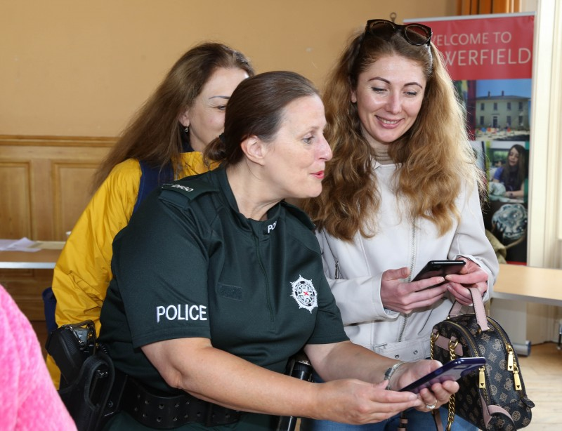 Causeway Coast and Glens PSNI Officer Sonya McMullan shares useful information with people who attended the refugee information event at Portrush Town Hall