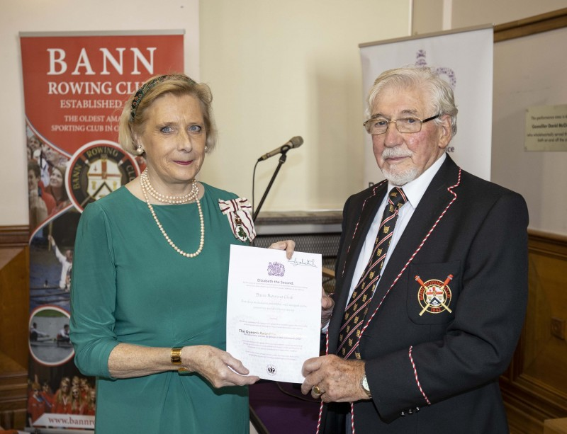 Lord-Lieutenant for County Londonderry Alison Millar pictured at the QAVS presentation event with Bann Rowing Club President Billy Bones and the special certificate received from Her Majesty The Queen