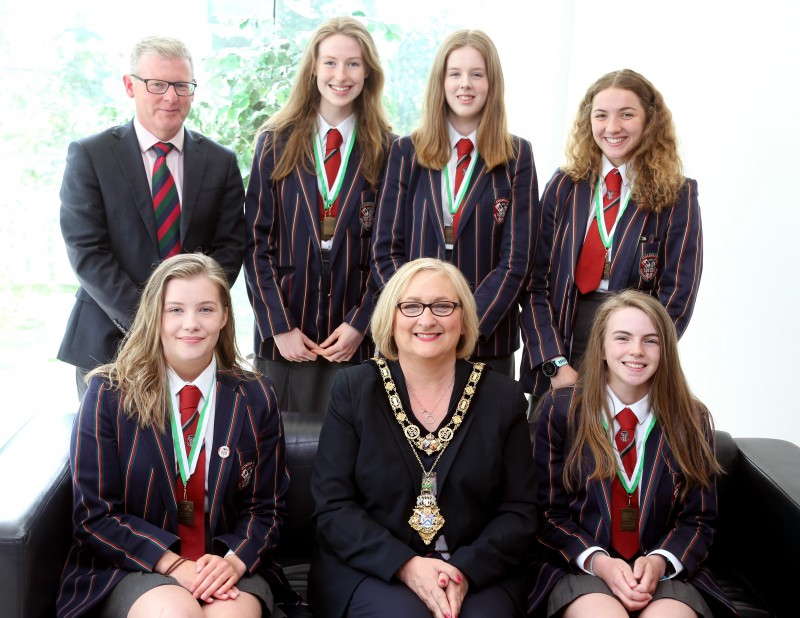 The woman’s under 16 coxed four winning team from Coleraine Grammar school pictured at a civic reception with the Mayor of Causeway Coast and Glens Borough Council, Councillor Brenda Chivers and school principal Dr David Carruthers.