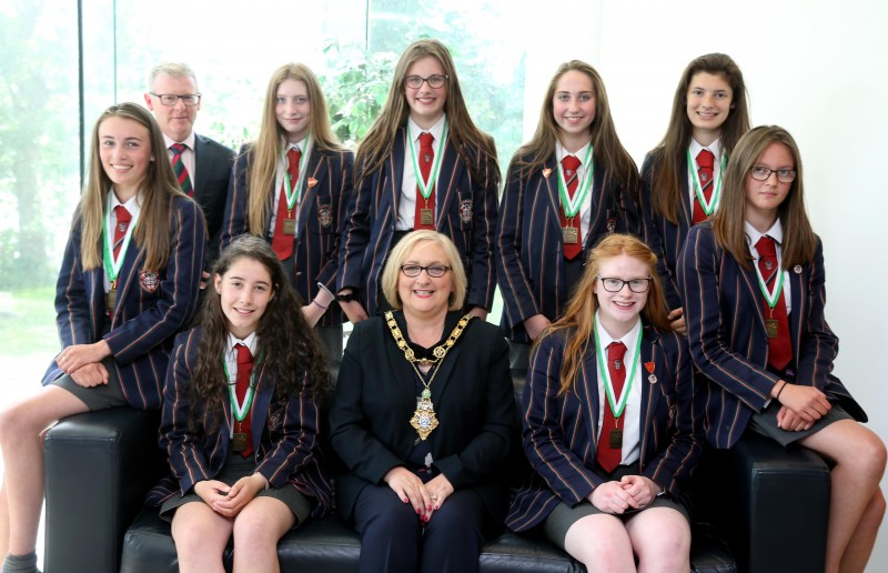 The Mayor of Causeway Coast and Glens Borough Council, Councillor Brenda Chivers pictured with Coleraine Grammar School woman’s under 15 eight winning rowing team and school principal Dr David Carruthers.