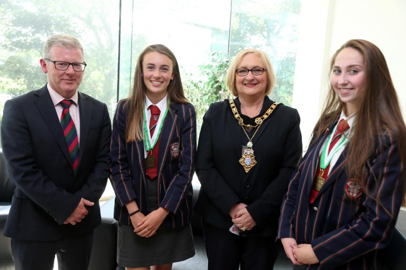 Under 15 double scull Irish champions Kathryn Boyce and Rachel Bones pictured with the Mayor of Causeway Coast and Glens Borough Council, Councillor Brenda Chivers and Dr David Carruthers, Coleraine Grammar School principal.