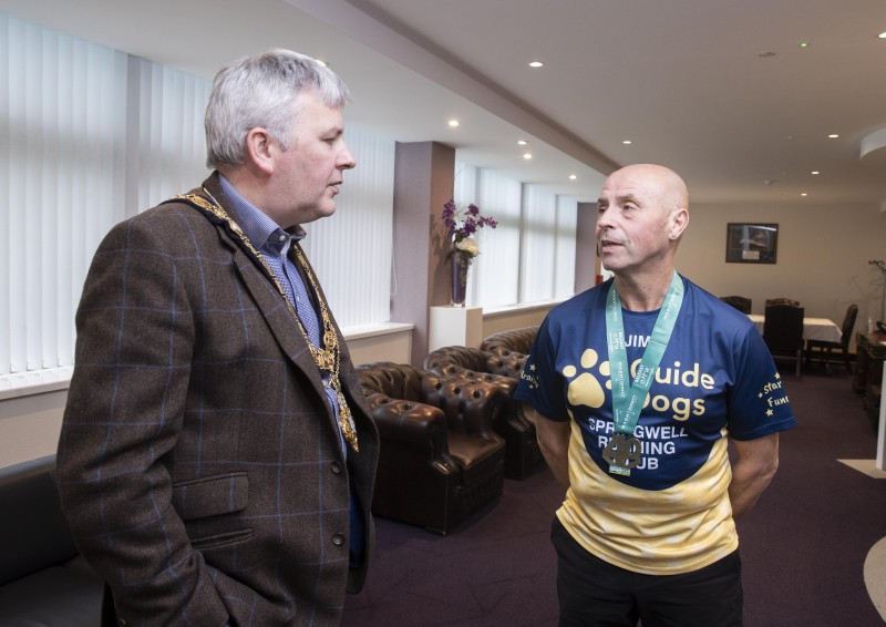 Jim Bradley (right) discusses his current fundraising campaign for Guide Dogs NI with the Mayor of Causeway Coast and Glens Borough Council, Councillor Richard Holmes.