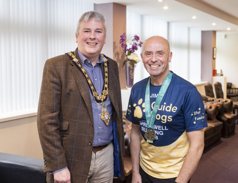 Garvagh man Jim Bradley (right) is currently completing five marathons in five weeks to help raise much needed funds for Guide Dogs NI. Jim was recently welcomed to Cloonavin for a special reception by the Mayor of Causeway Coast and Glens Borough Council, Councillor Richard Holmes