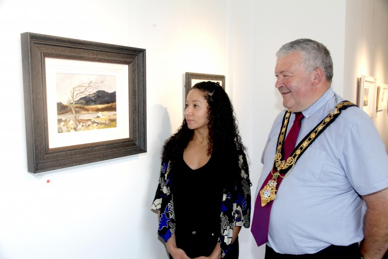 The Mayor of Causeway Coast and Glens Borough Council Councillor Ivor Wallace and Arts and Cultural Facilities Officer Esther Alleyne view a beautiful piece currently on display in Jim Holmes’ new exhibition at Roe Valley Arts and Cultural Centre.