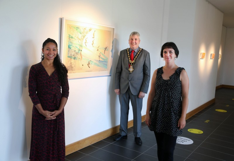 Pictured left to right are Arts Officer Esther Alleyne, the Mayor of Causeway Coast and Glens Borough Council Councillor Richard Holmes and artist Susan Hughes. Susan’s new exhibition ‘West Light’ is now open to the public at Roe Valley Arts and Cultural Centre in Limavady.