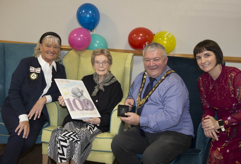 Deputy Lieutenant of County Londonderry Lorraine Young, 100-year-old Sadie Gage, the Mayor of Causeway Coast and Glens Borough Council, Councillor Ivor Wallace, and Hezlet Court Scheme Co-ordinator Gillian Rea pictured at Sadie’s 100th birthday celebrations.