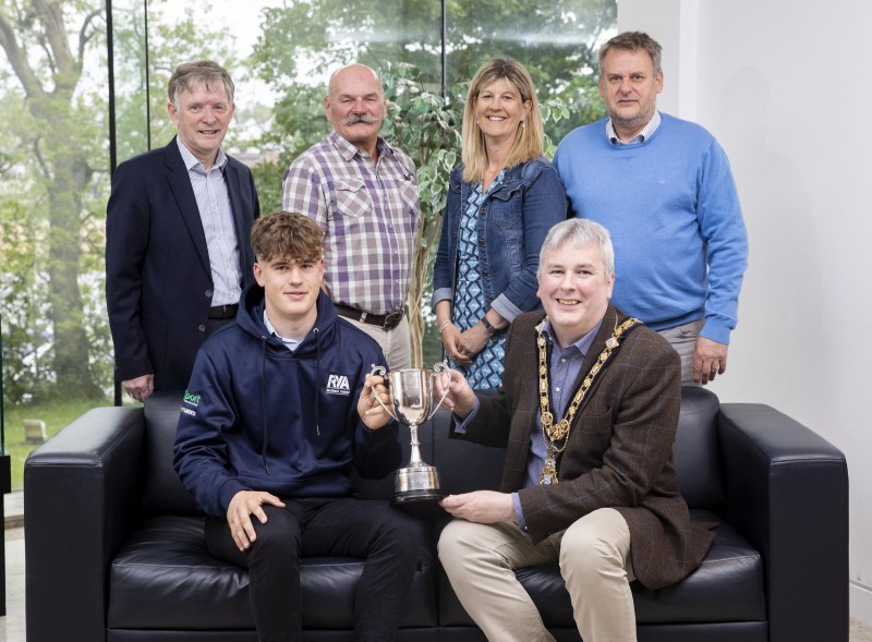 Sailing star Tom Coulter (front-left) pictured with the Mayor of Causeway Coast and Glens Borough Council, Councillor Richard Holmes during a recent reception held in his honour in Cloonavin. Also pictured, back row (left-right) are: Alderman Mark Fielding, Ivor Neill, Portrush Yacht Club Principal and Tom’s parents Juliet and Peter.
