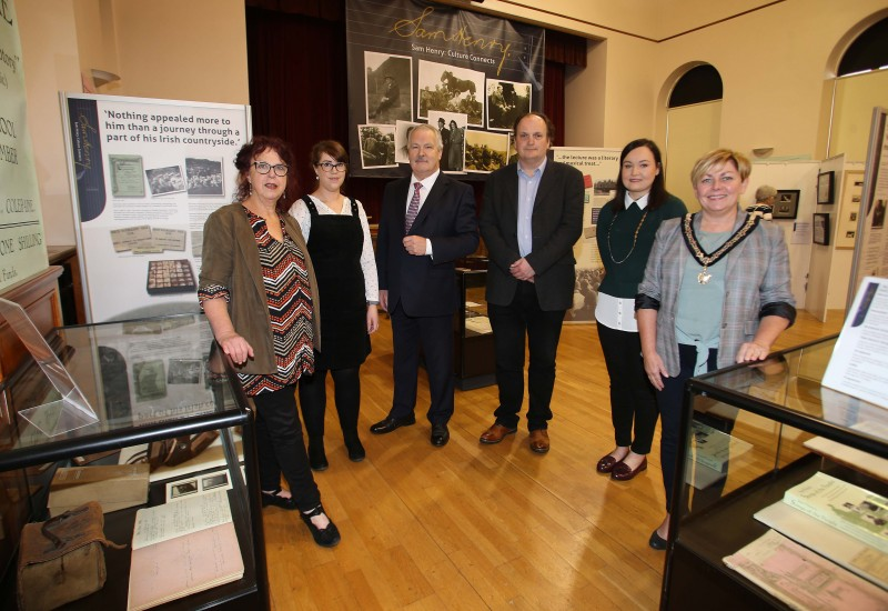 The Deputy Mayor of Causeway Coast and Glens Borough Council, Alderman Sharon McKillop pictured with Helen Perry, Museum Services Development Manager, Sarah Carson, Museum Officer, Gordon Craig, Sam Henry’s grandson, Dr Frank Ferguson from Ulster University and Rachel Archibald, Project Cataloguer at the launch of the ‘Sam Henry: Culture Connects’ exhibition at Ballymoney Museum.