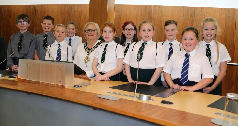 The Mayor of Causeway Coast and Glens Borough Council, Councillor Brenda Chivers pictured with pupils from Killowen Primary School and St John’s Primary School  in Coleraine in the Council Chamber.