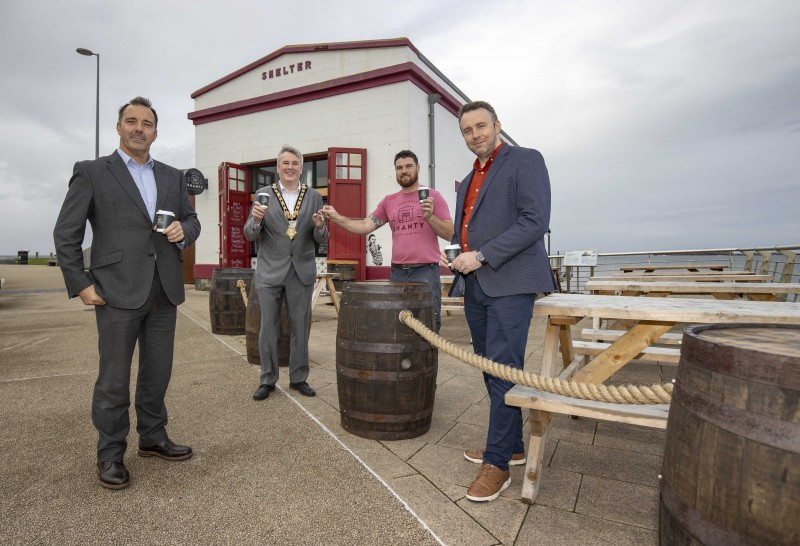 The Mayor of Causeway Coast and Glens Borough Council Councillor Richard Holmes pictured with (left – right) Richard McLaughlin from Northern Real Estate, Kevin McCarry, proprietor of Shanty Brews and Bites and Wayne Hall, Causeway Coast and Glens Borough Council’s Asset Realisation Officer.