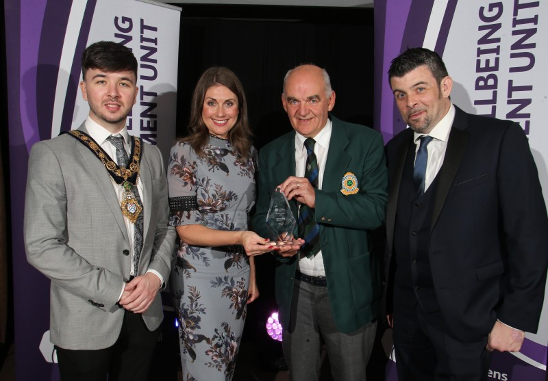 Tommy Smith from Ballymoney Bowling Club accepts the international Sportsperson of the Year award on behalf of Gary Kelly with the Mayor of Causeway Coast and Glens Borough Council Councillor Sean Bateson, Master of Ceremonies Sarah Travers and Barry Dallat, representing award sponsor Arbutus Catering Group.