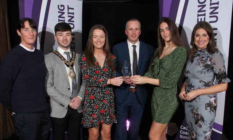 Jenny and Olivia, representing Dalriada Under 19 Girls Volleyball Team, winners of the Junior Sports Team of the Year, pictured with the Mayor of Causeway Coast and Glens Borough Council Councillor Sean Bateson, Master of Ceremonies Sarah Travers and Gill Small representing award sponsor Smallcost Carpets.