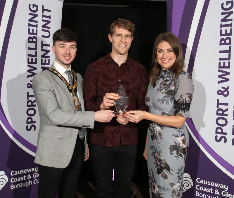 Rugby legend Andrew Trimble accepts his Hall of Fame award at Causeway Coast and Glens Borough Council’s Gala Sports Awards from the Mayor of Causeway Coast and Glens Borough Council Councillor Sean Bateson and Master of Ceremonies Sarah Travers.