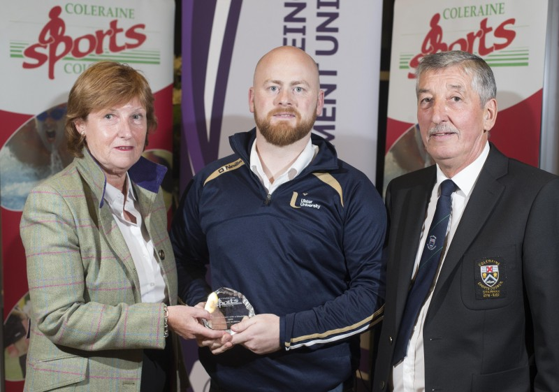 Michael McMillan, Sports Person with a Disability, receives his award from special guest Wilma Erskine and John Church, Chair of Coleraine Sports Council.
