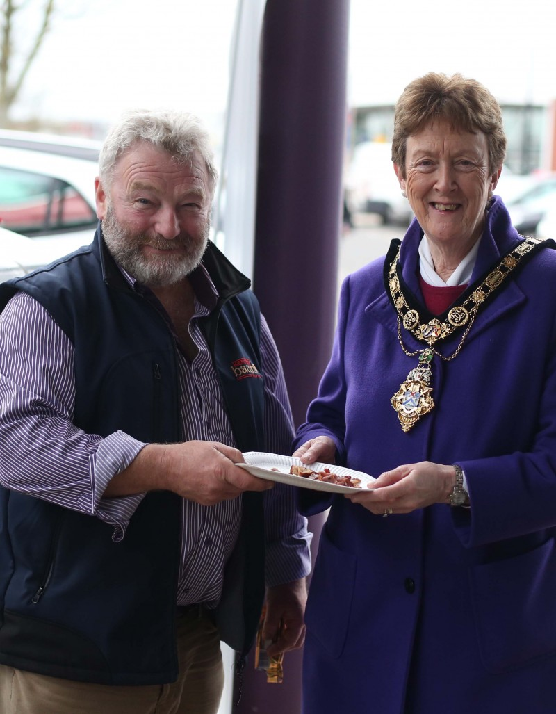 The Mayor of Causeway Coast and Glens Borough Council, Councillor Joan Baird, OBE pictured sampling some bacon with Mervyn Kennedy from Kennedy Bacon at Ballymoney Spring Fair.