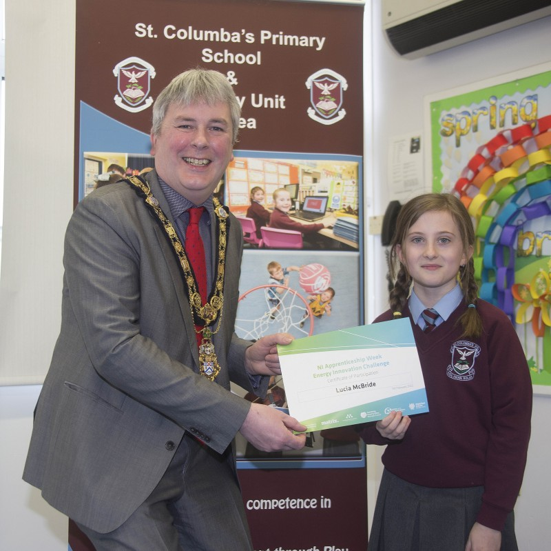 The Mayor of Causeway Coast and Glens Borough Council Councillor Richard Holmes presents a certificate to Lucia McBride who took part in the Energy Innovation Challenge.