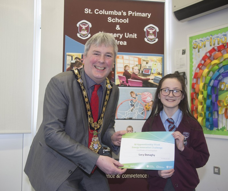 The Mayor of Causeway Coast and Glens Borough Council Councillor Richard Holmes presents a certificate to Lucy Donaghy who took part in the Energy Innovation Challenge.