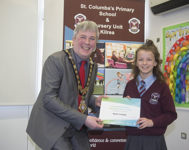 The Mayor of Causeway Coast and Glens Borough Council Councillor Richard Holmes presents a certificate to Rachel McAuley who took part in the Energy Innovation Challenge.