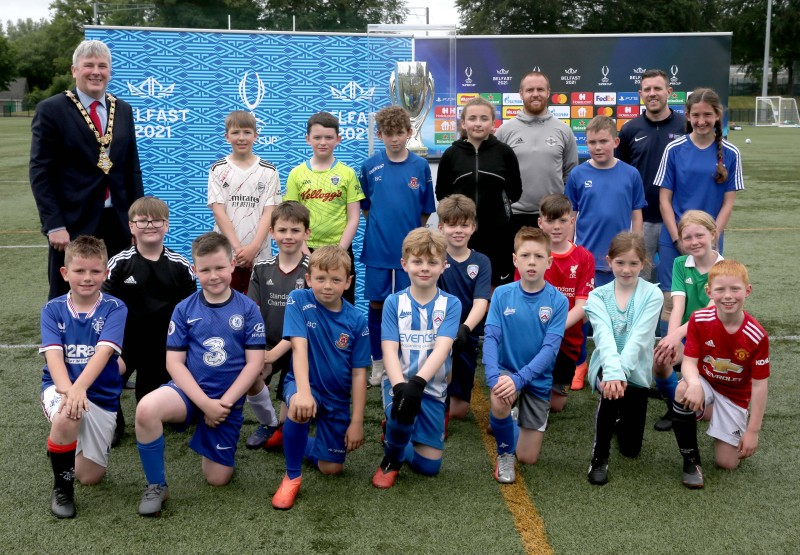 Jonny McFadden Causeway Coast and Glens Borough Council Sports Development Manager, Mayor, Councillor Richard Holmes and Ronan O’Donnell from the IFA with young players at the football camp.